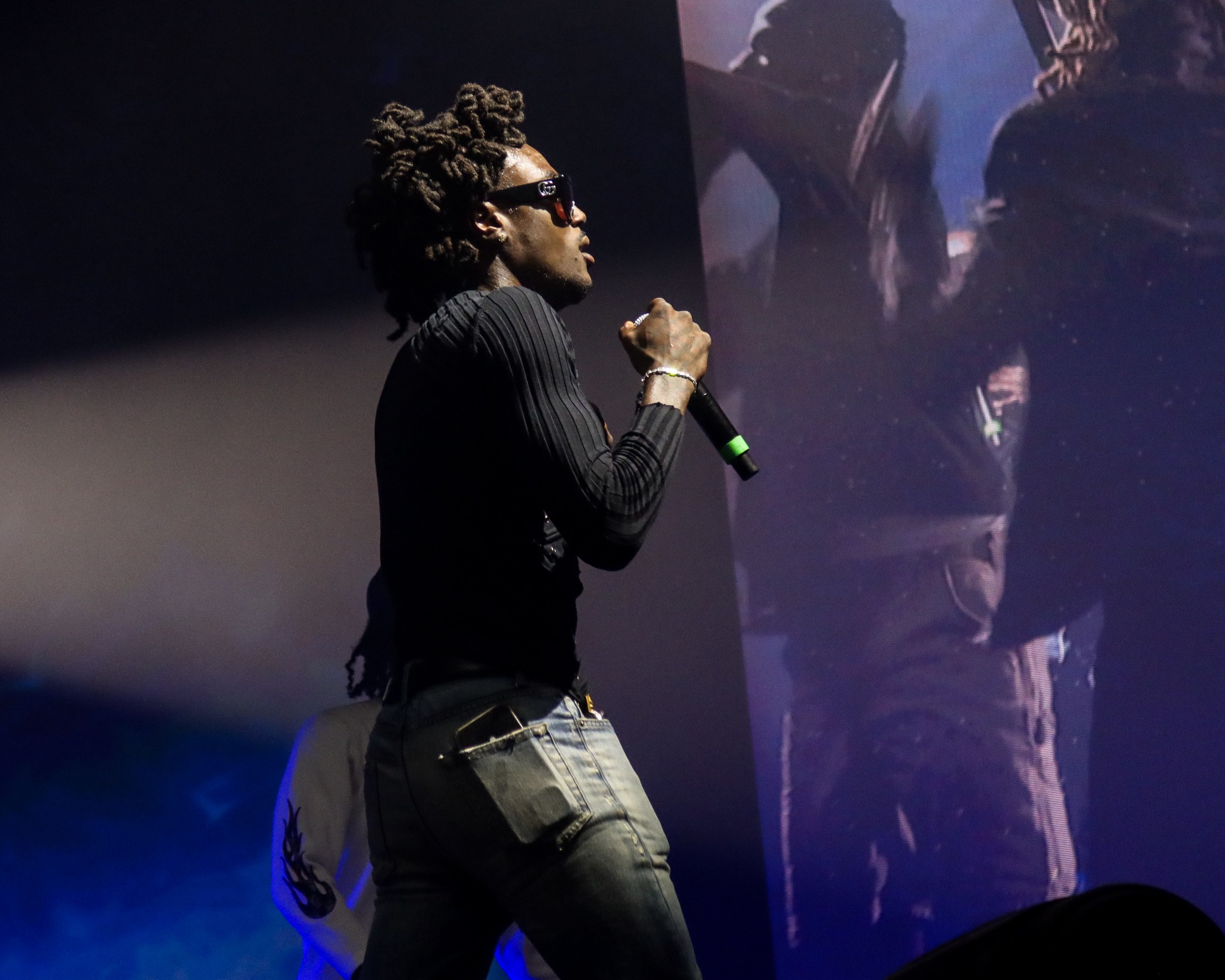 Young Thug performing beside the stage screen