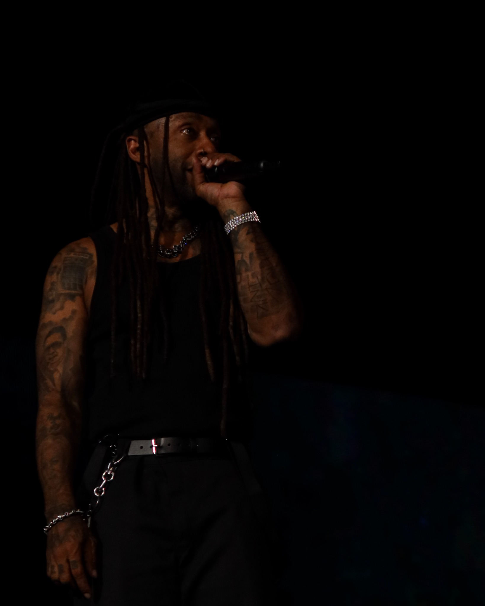 Ty Dolla $ign performing under a spotlight