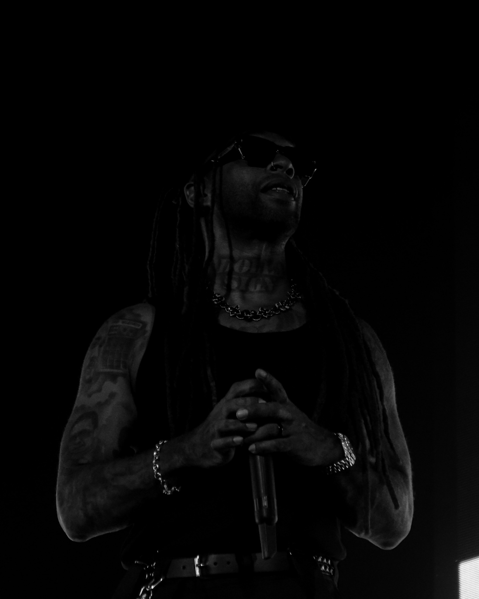 Ty Dolla $ign standing in low-key stage light