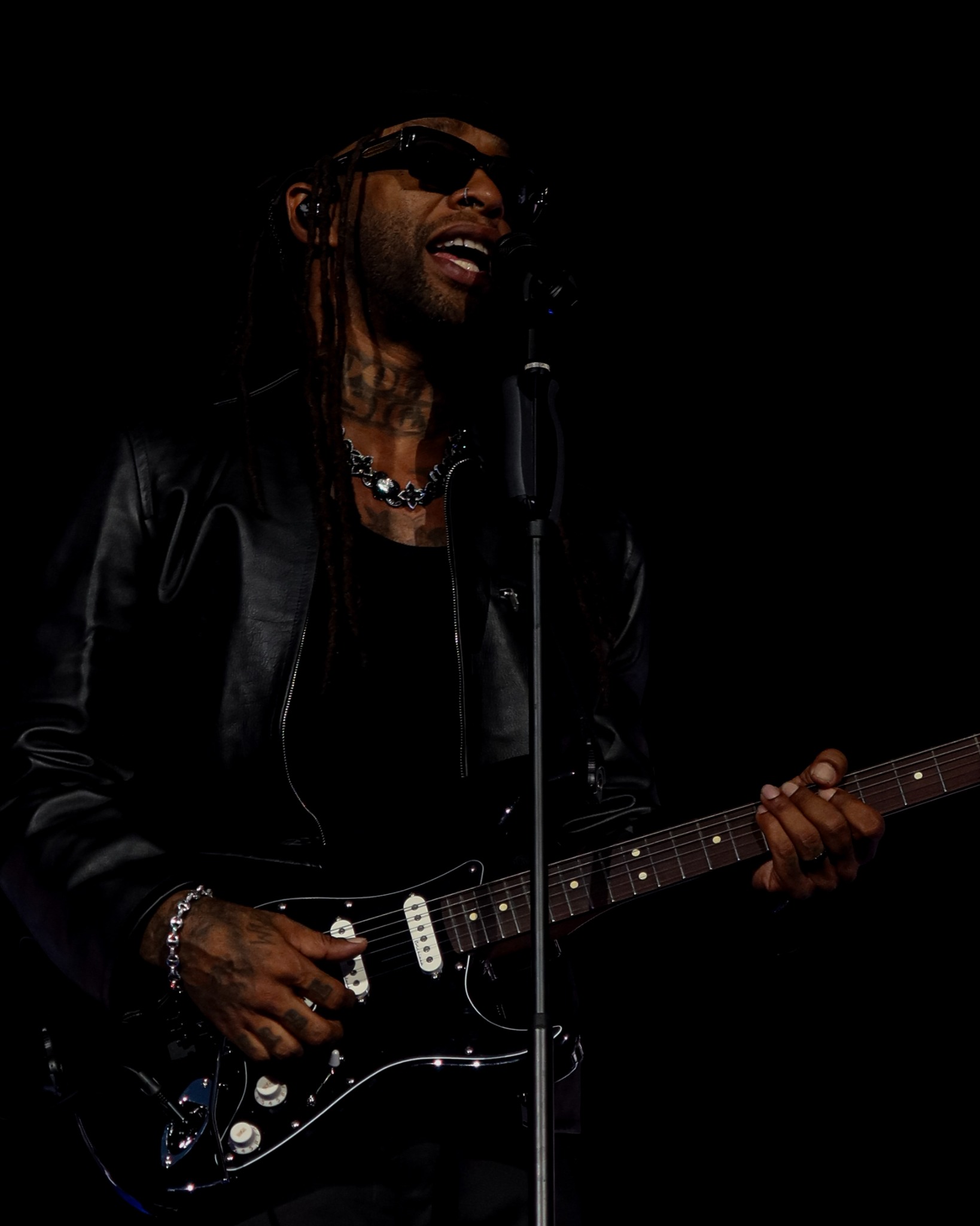 Ty Dolla $ign playing guitar onstage