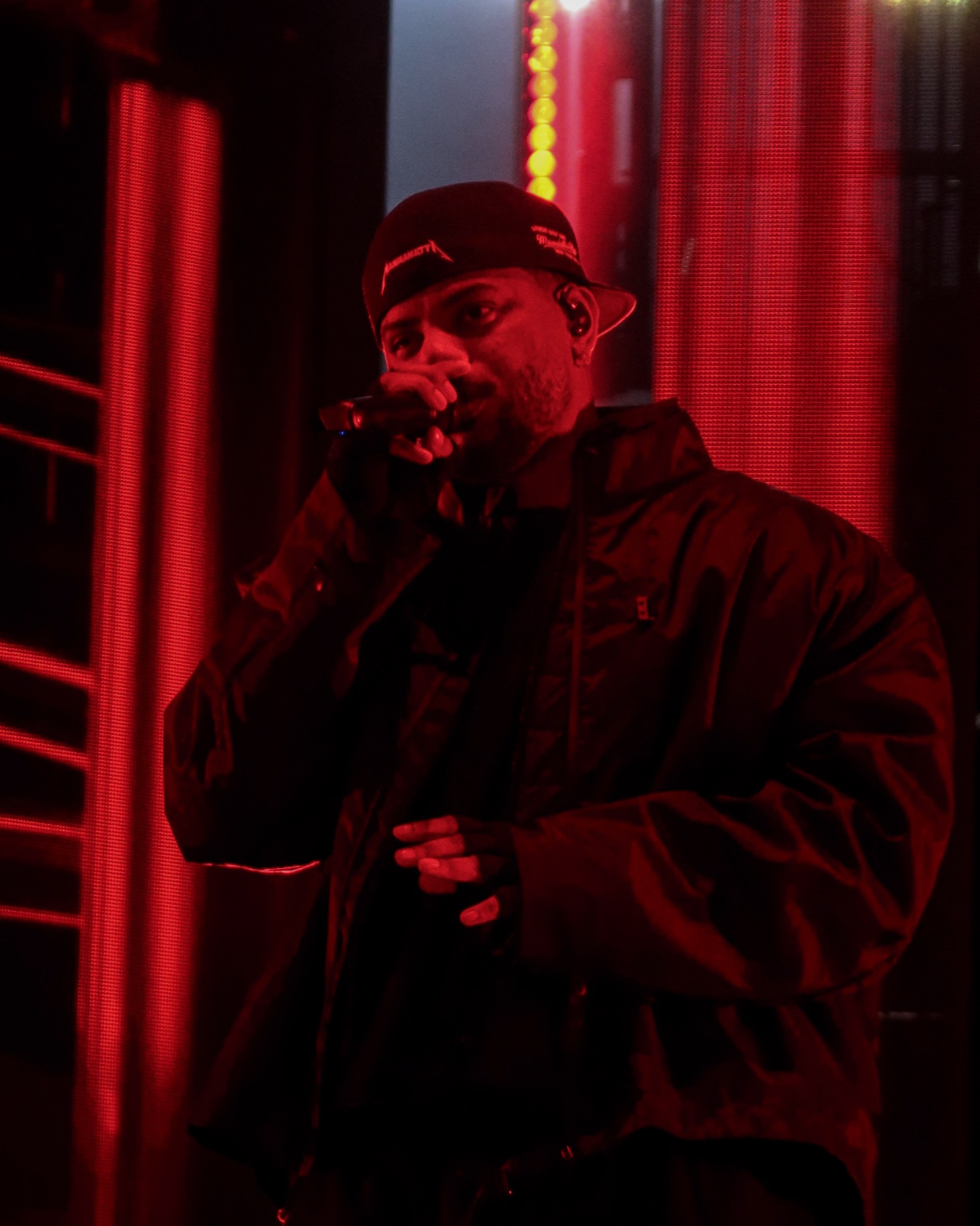 Bryson Tiller performing in vivid red light
