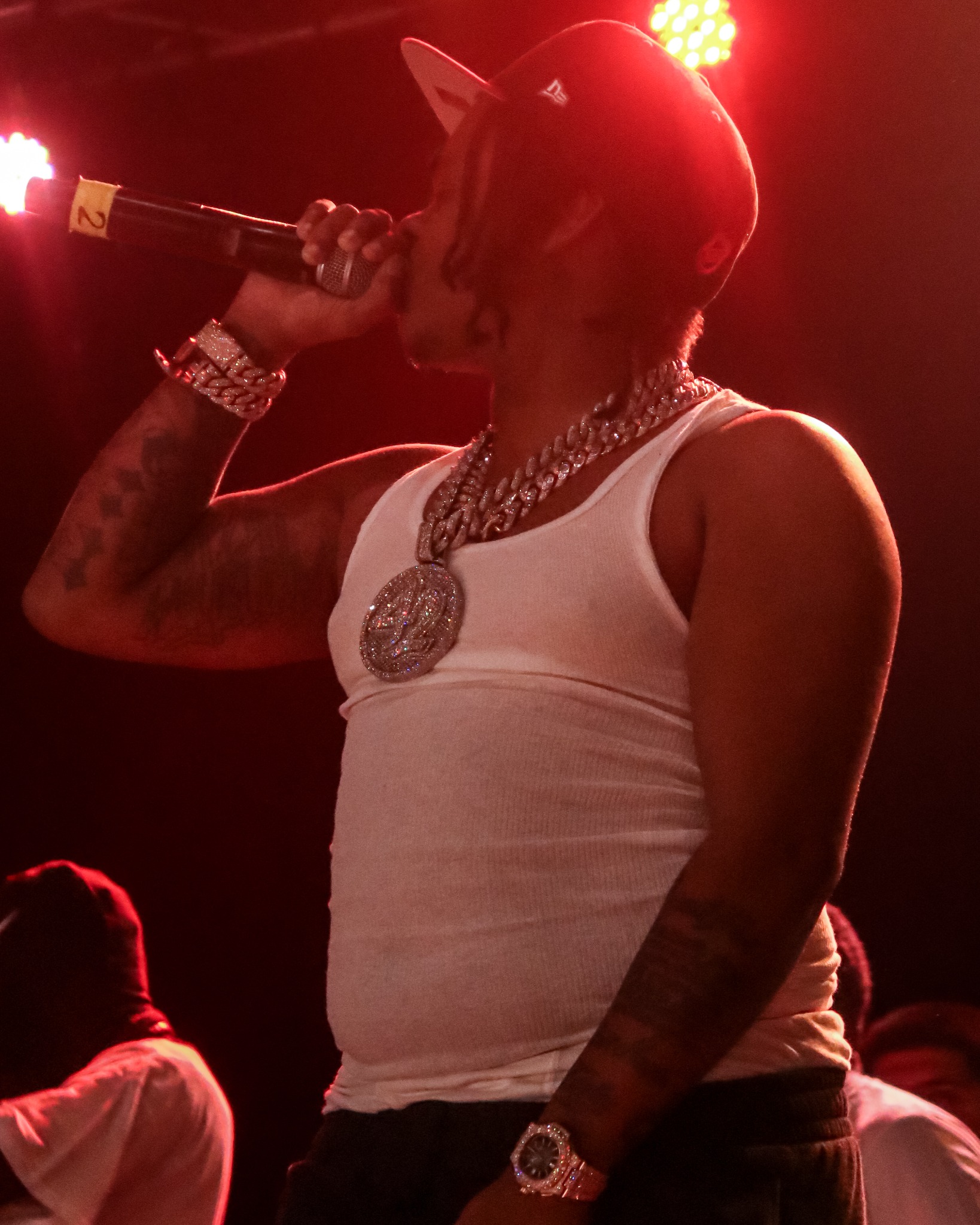 42 Dugg performing under deep red stage lighting